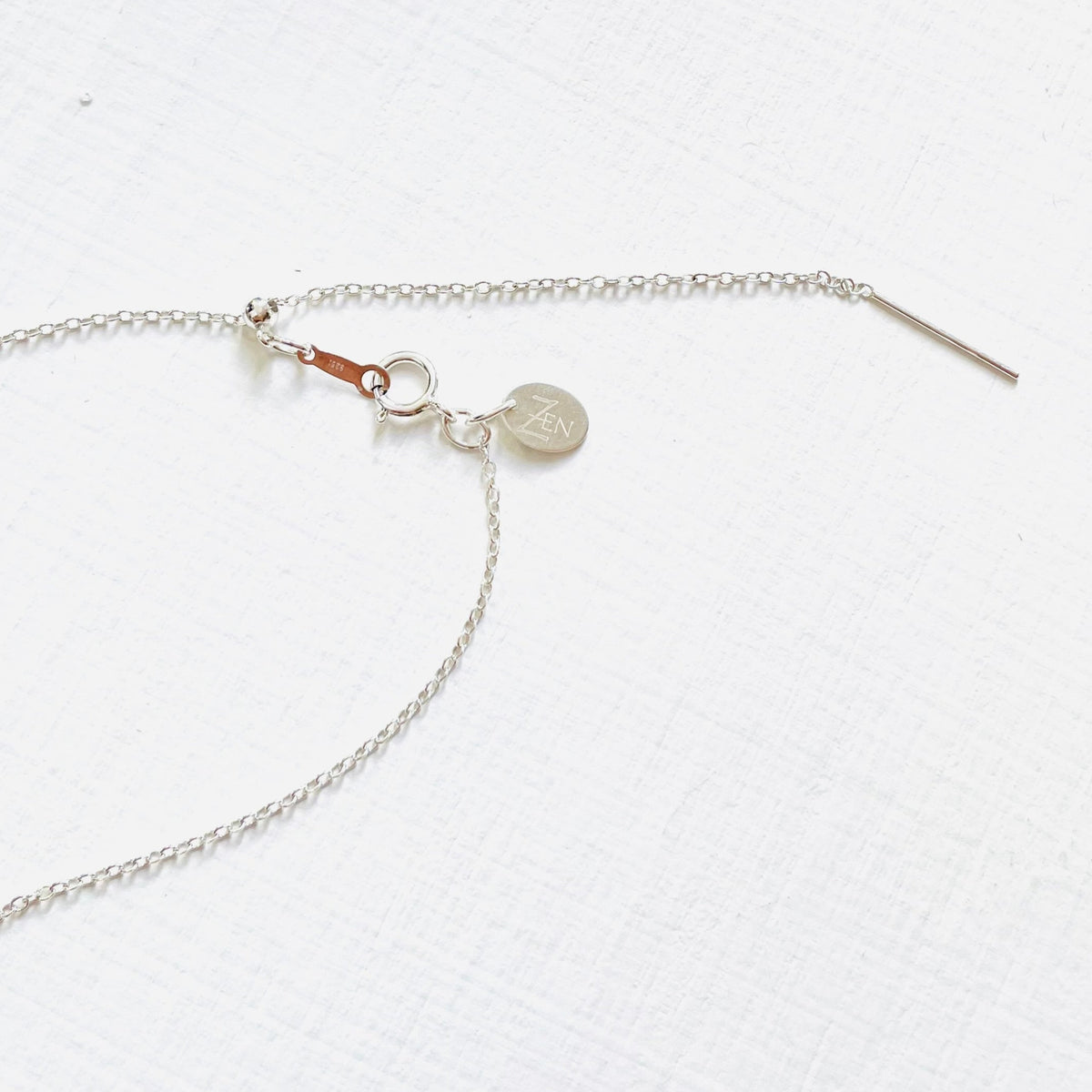 Floating Pearl Adjustable Necklace by ZEN by Karen Moore showing silver adjustable chain on white background