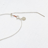 Floating Pearl Adjustable Necklace by ZEN by Karen Moore showing silver adjustable chain on white background