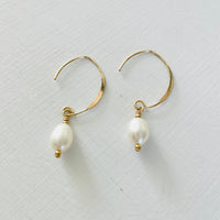 Classy Crescent Pearl  Earrings by ZEN by Karen Moore Jewelry gold angled view on white background