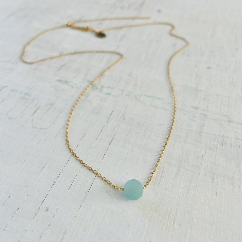 The Jenny Blues Amazonite Necklace by ZEN by Karen Moore on white wood alternate view