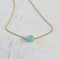 The Jenny Blues Amazonite Necklace by ZEN by Karen Moore on white wood showing blue stone