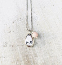 Just BE Free Charm Necklace by ZEN by Karen Moore Jewelry alternate close up of charms on white wood