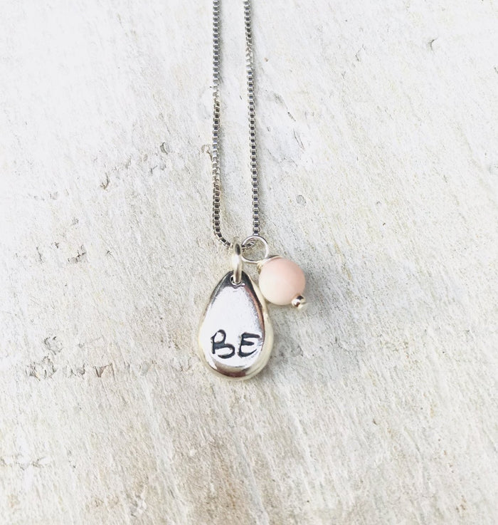 Just BE Free Charm Necklace by ZEN by Karen Moore Jewelry alternate close up of charms on white wood