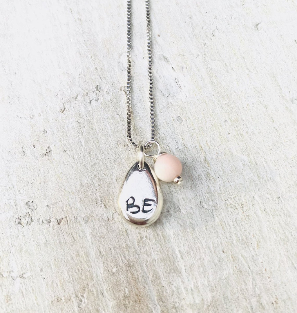 Just BE Free Charm Necklace by ZEN by Karen Moore Jewelry alternate close up of charms on white wood