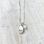 Just BE Nutured Charm Necklace by ZEN by Karen Moore Jewelry alternate close up of charms on white wood