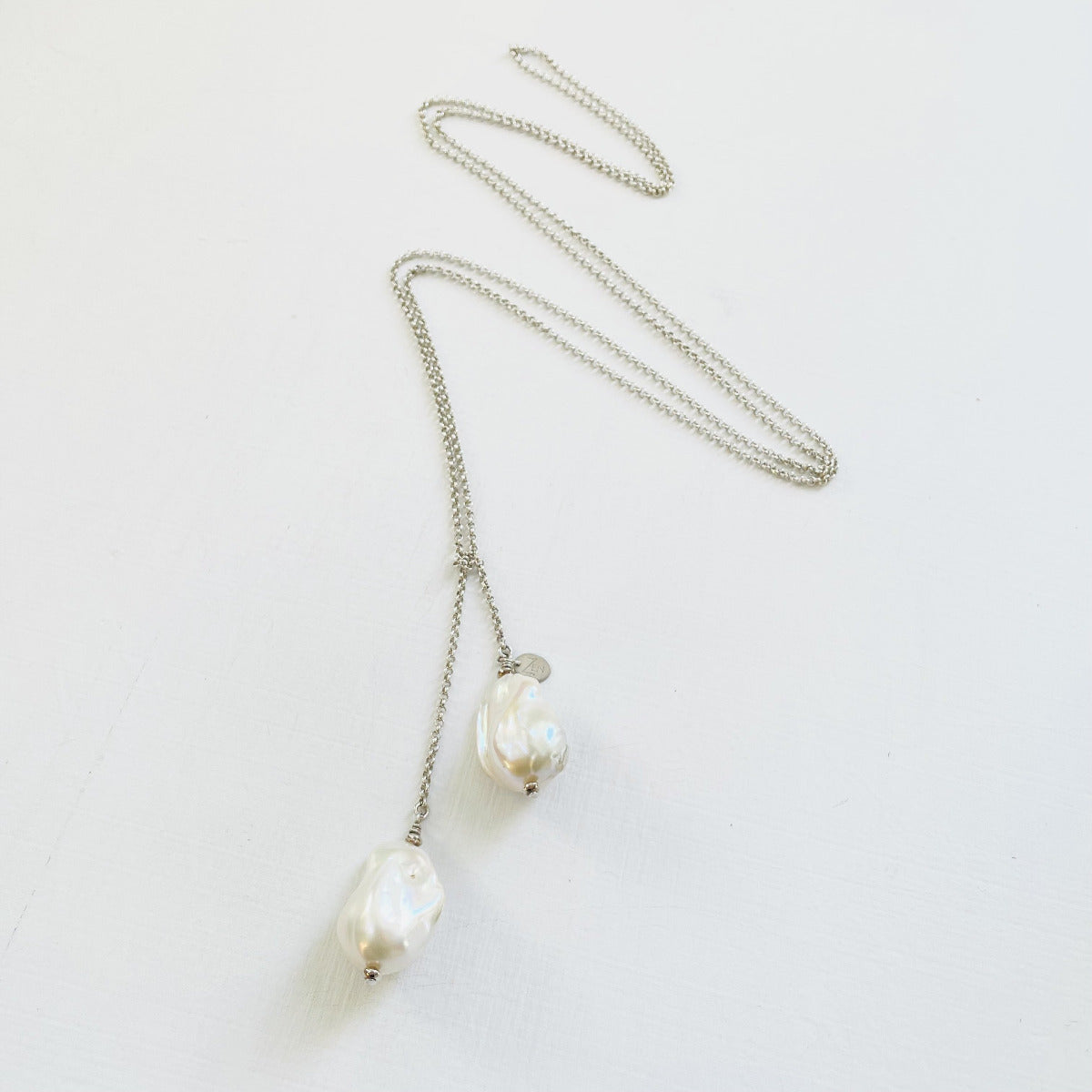 Wisdom Within ZEN Wrap Necklace by ZEN by Karen Moore Jewelry showing chain zig-zagged on a white background