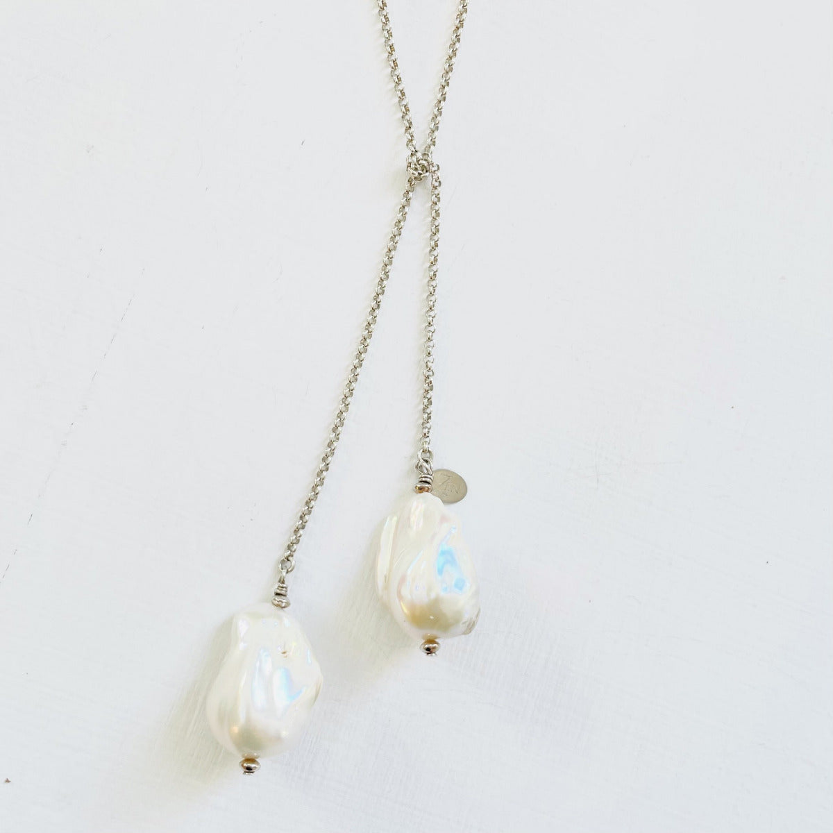 Wisdom Within ZEN Wrap Necklace by ZEN by Karen Moore Jewelry close up of pearls on a white background