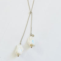 Wisdom Within ZEN Wrap Necklace by ZEN by Karen Moore Jewelry close up of pearls on a white background