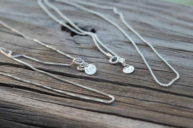 Ball chains for Simply Conch Shell Necklace with mini gem by ZEN by Karen Moore on wood background