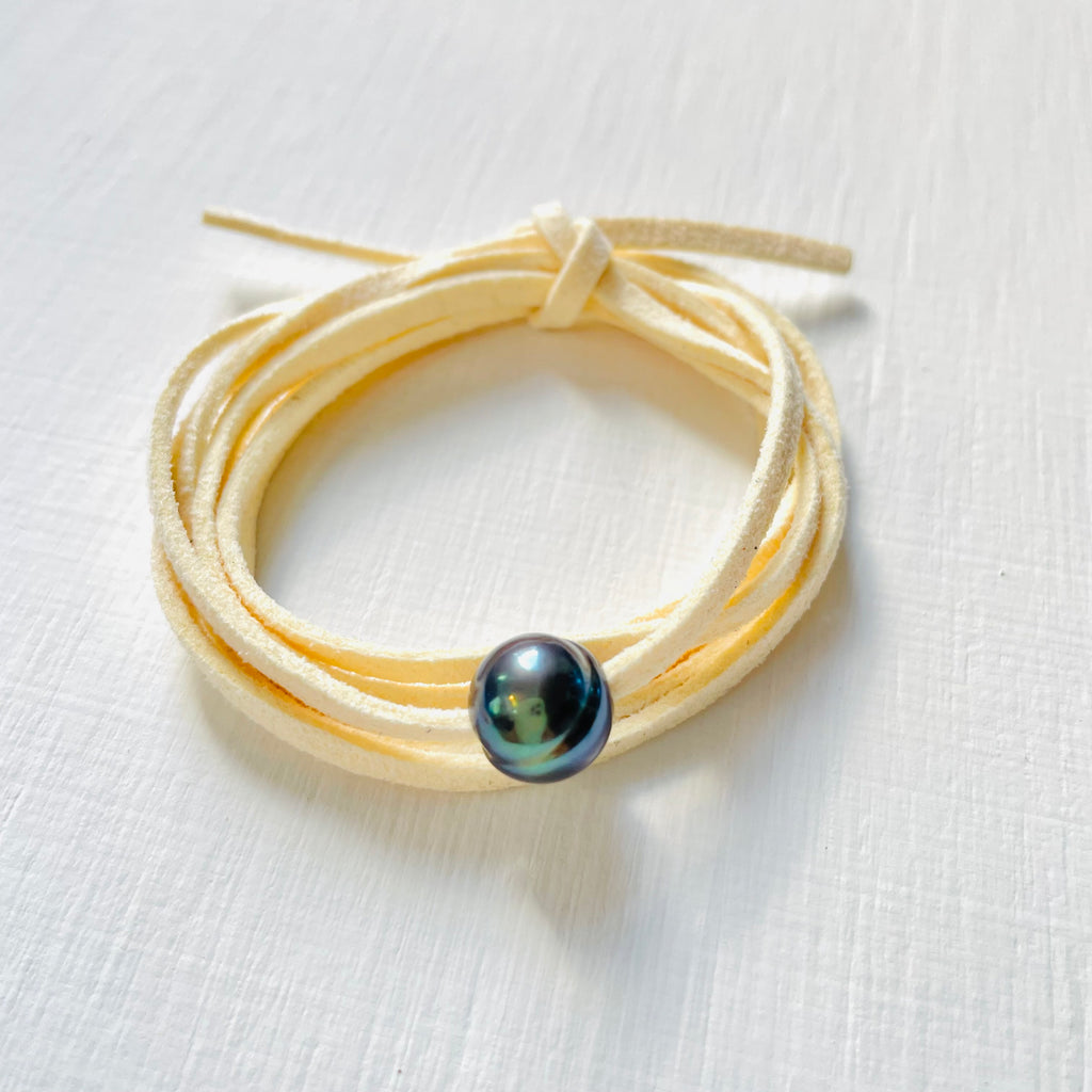Pearl Of Wisdom Vanilla Vibes Eco Zen Wrap Jewelry by ZEN by Karen Moore angled view on white wood
