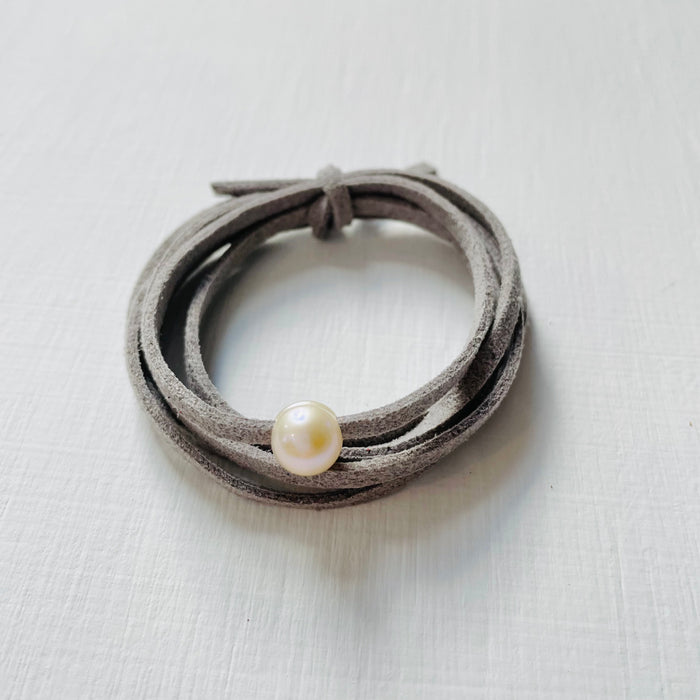 Pearl Of Wisdom Cool Stone Eco Zen Wrap Jewelry by ZEN by Karen Moore front view on white wood