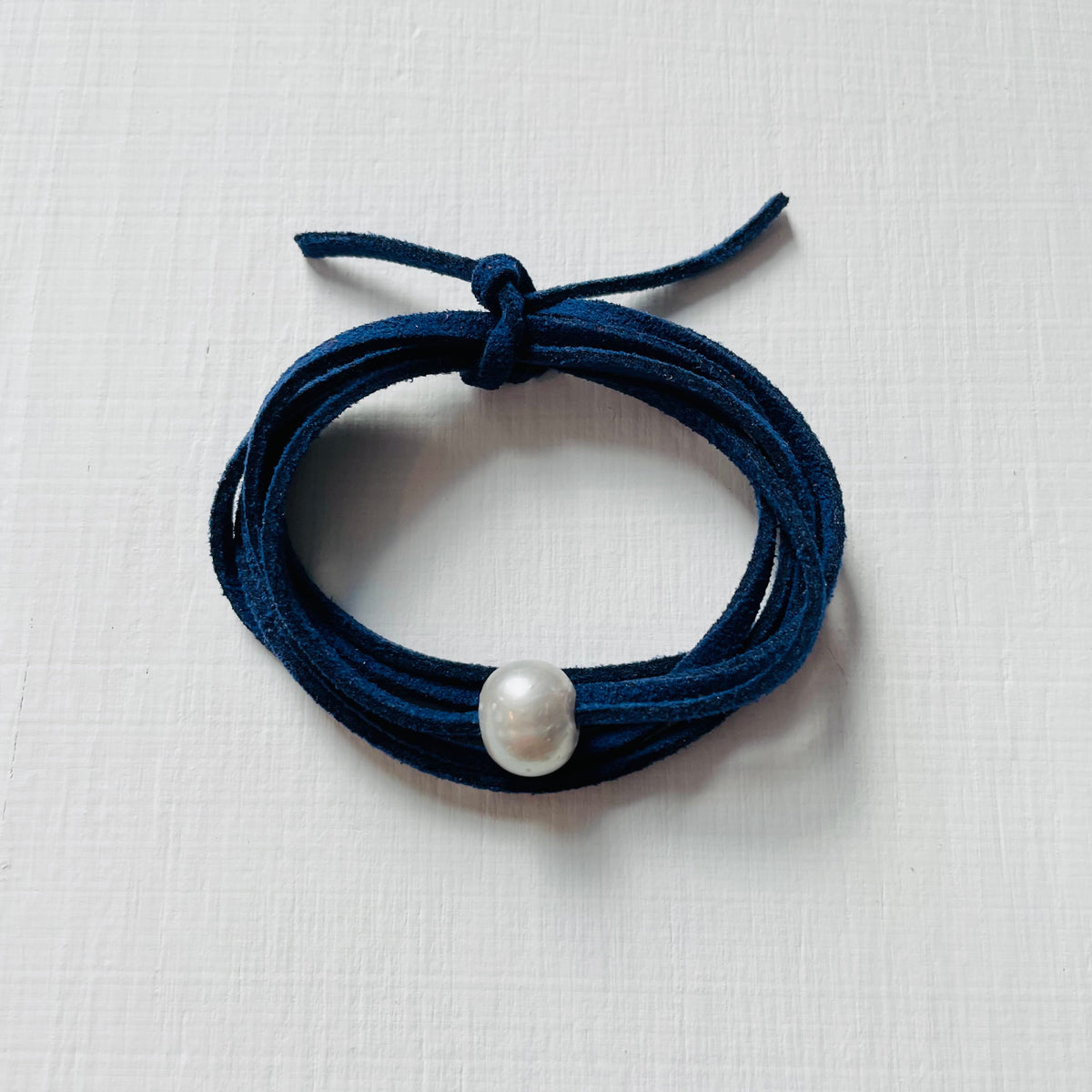 Pearl Of Wisdom Classy Navy Eco Zen Wrap Jewelry by ZEN by Karen Moore on white wood