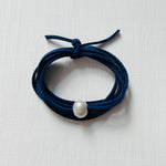 Pearl Of Wisdom Classy Navy Eco Zen Wrap Jewelry by ZEN by Karen Moore on white wood