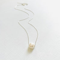 Floating Pearl Adjustable Necklace by ZEN by Karen Moore with silver chain on white background