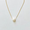 Floating Pearl Adjustable Necklace by ZEN by Karen Moore with gold chain on white background showing pearl gemstone