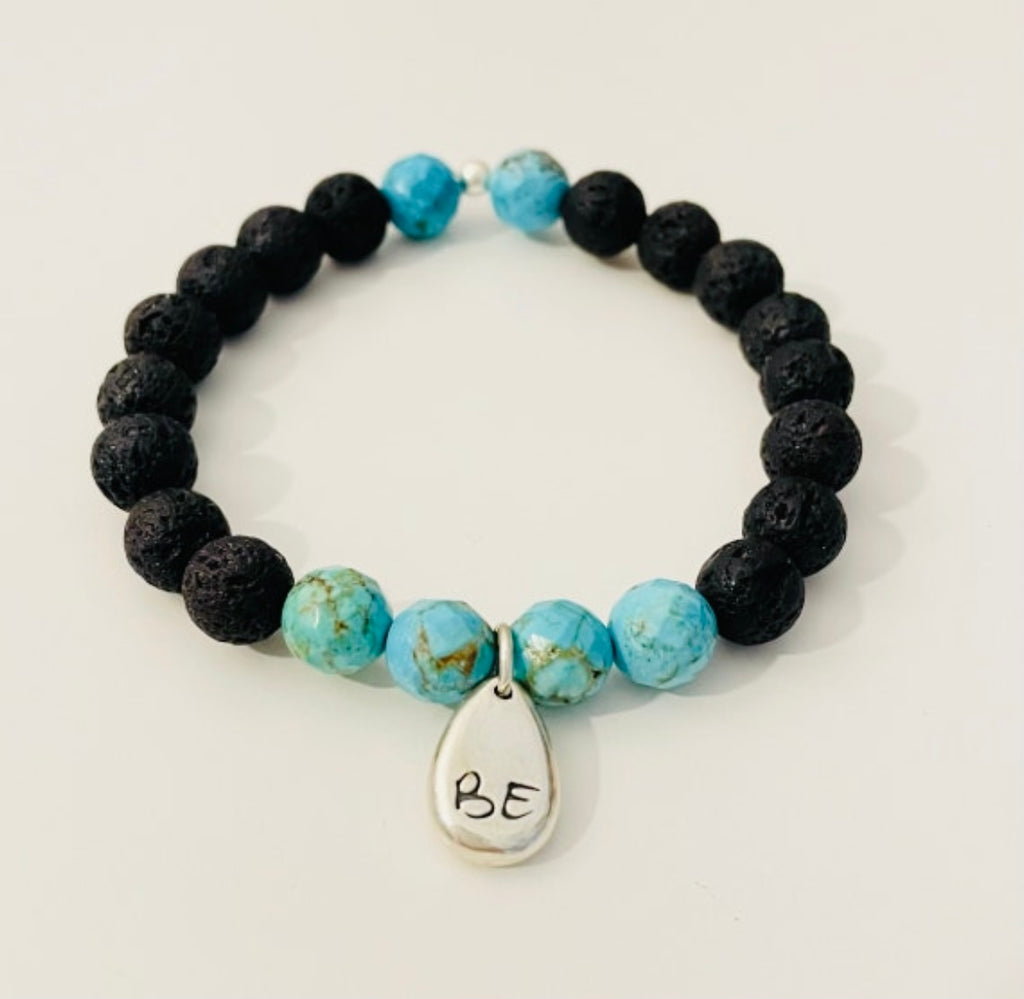 African turquoise & lava stone Just Be Strong Aromatherapy Bracelet by ZEN by Karen Moore on white background