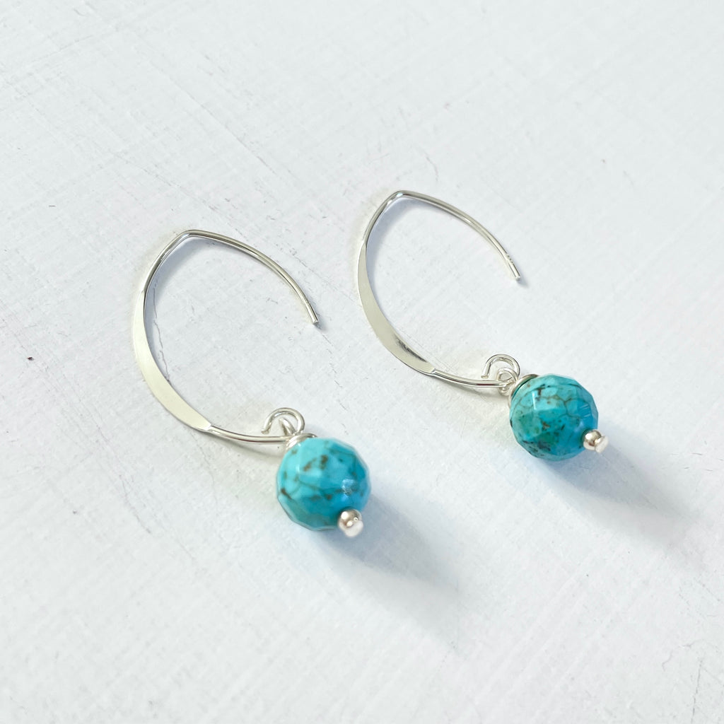 Classy Turquoise Crescent Earrings by ZEN by Karen Moore angled view on white background