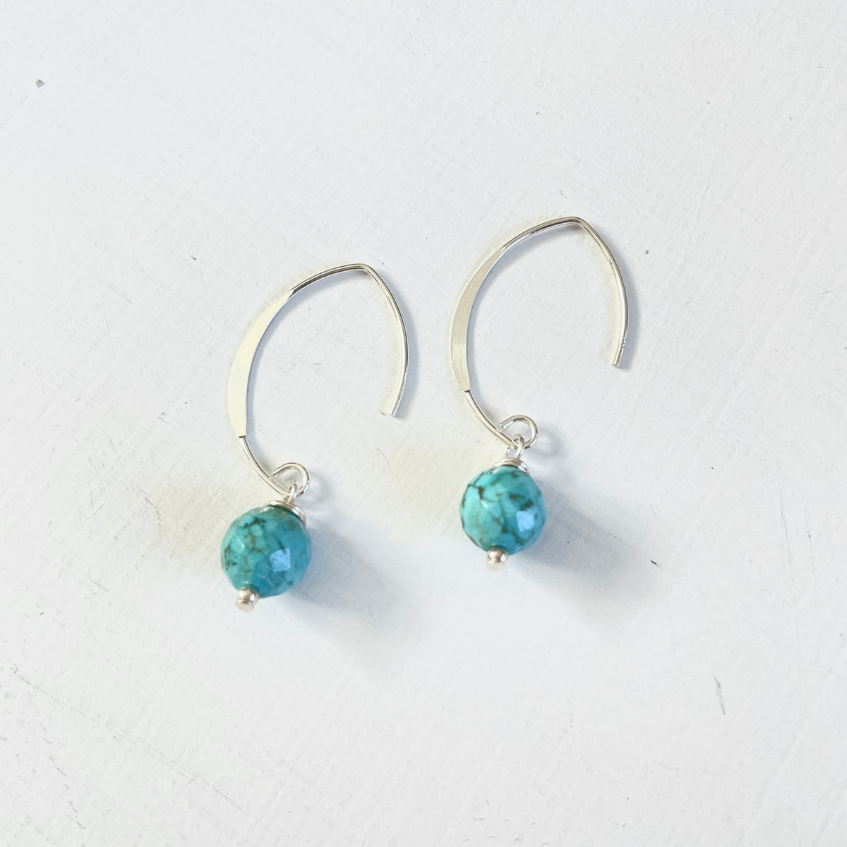 Classy Turquoise Crescent Earrings by ZEN by Karen Moore on white background