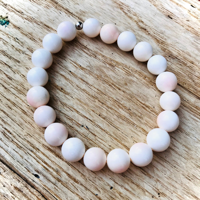 Conch shell Clarity By The Sea Conch Shell Bracelet by ZEN by Karen Moore on wood background