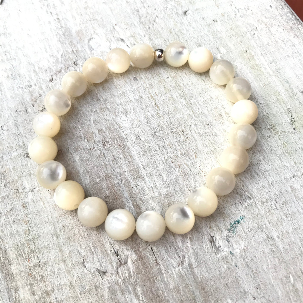Be Nurtured Mother-of-Pearl Bracelet by ZEN by Karen Moore with silver accent bead on white wood