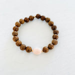 Mojo Conch Shell Tiger Wood Bracelet by ZEN by Karen Moore on white wood background