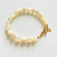Nurtured by Nature Mother of Pearl Bracelet with 14K gold clasp by ZEN by Karen Moore jewelry zoomed overhead view on white background