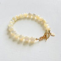 Nurtured by Nature Mother of Pearl Bracelet with 14K gold clasp by ZEN by Karen Moore jewelry angled view on white background