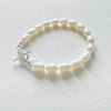Brilliant White Pearl Bracelet by ZEN by Karen Moore jewelry with sterling silver clasp close up on white background