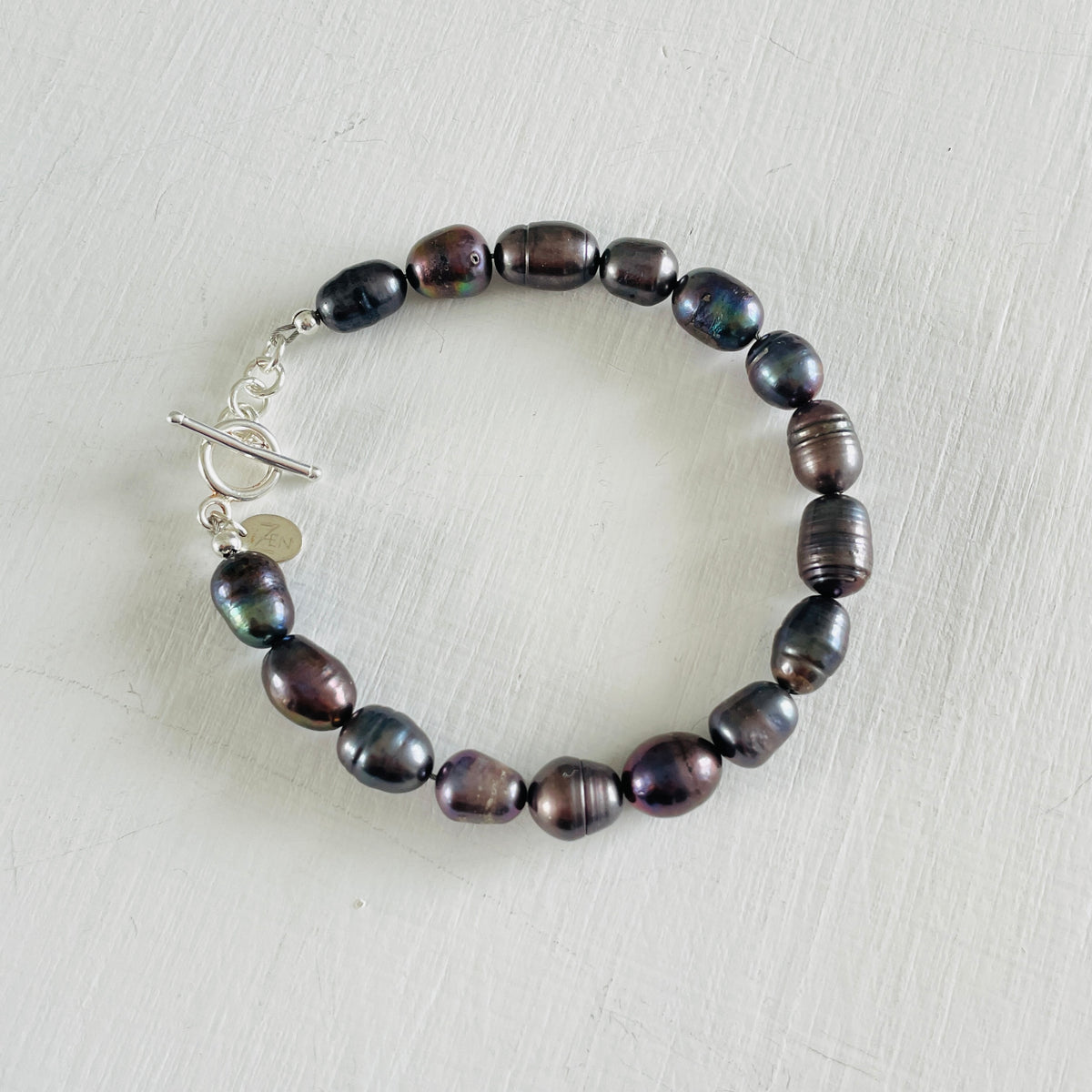 Mermaid Pearl Bracelet with sterling silver by ZEN by Karen Moore jewelry overhead view on white background