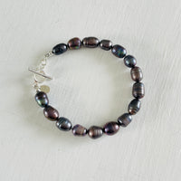Mermaid Pearl Bracelet with sterling silver by ZEN by Karen Moore jewelry overhead view on white background