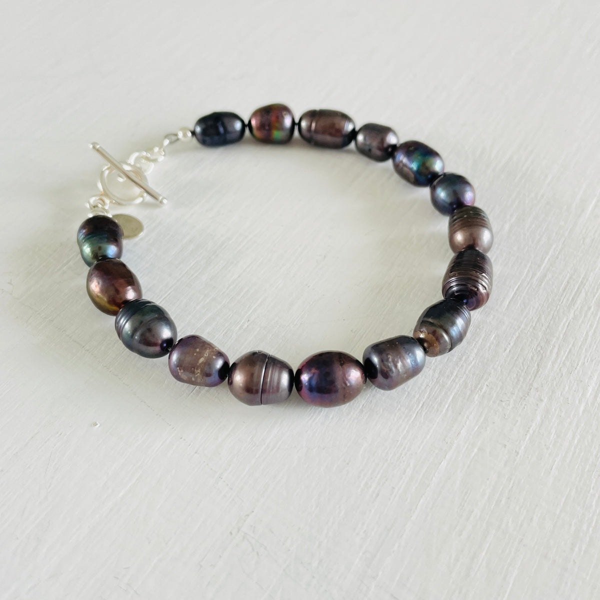 Mermaid Pearl Bracelet with sterling silver by ZEN by Karen Moore jewelry angled view on white background