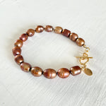 Bronze Pearl Bracelet by ZEN by Karen Moore jewelry with 14K gold clasp angled view on white background