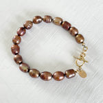 Bronze Pearl Bracelet by ZEN by Karen Moore jewelry with 14K gold clasp on white background