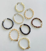 group of Mother of Pearl Bracelets by ZEN by Karen Moore jewelry overhead view on white background