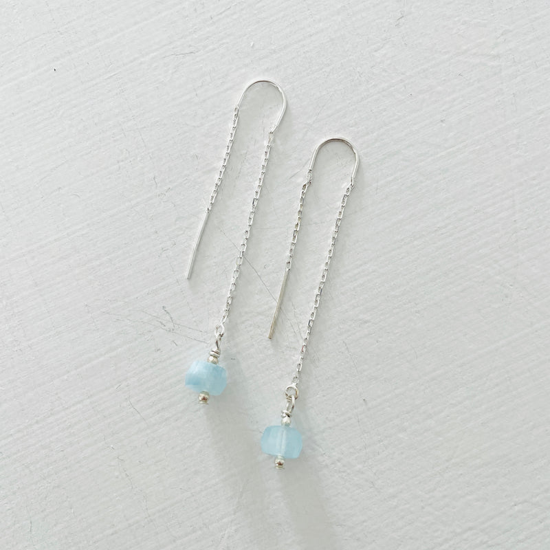 Drop into the Calm Aquamarine Earrings by ZEN by Karen Moore jewelry in sterling silver on white background