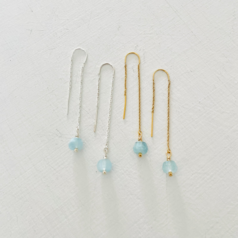 Drop into the Calm Aquamarine Earrings by ZEN by Karen Moore jewelry showing a pair in sterling silver and a pair in 14K gold on white background