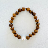 Mojo Freshwater Pearl Tiger Wood Bracelet by ZEN by Karen Moore on white wood background