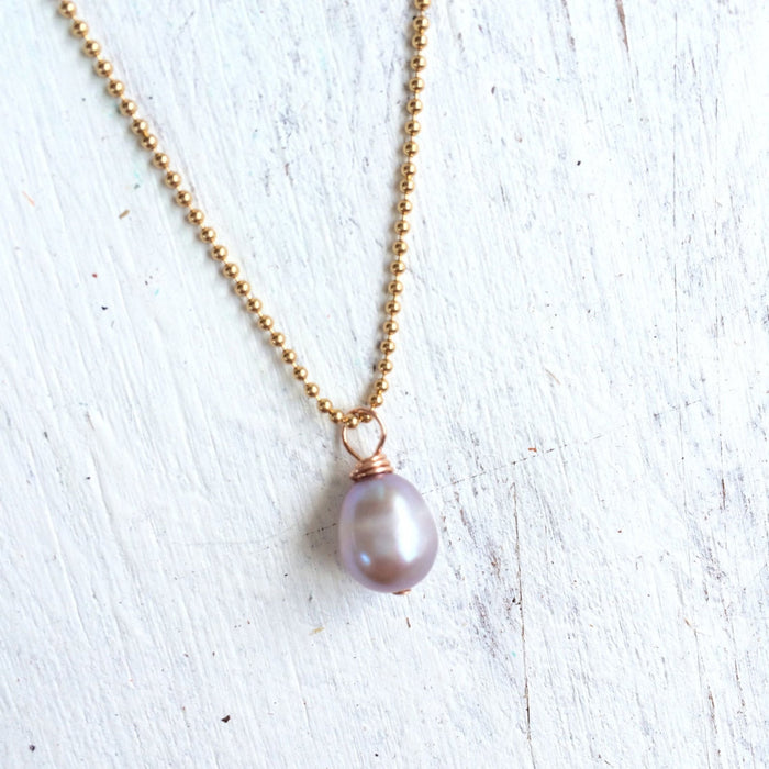 Island Love pearl necklace by ZEN by Karen Moore angled view on white wood