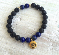 Lapis lazuli & lava stone OM Serenity Aromatherapy Bracelet by ZEN by Karen Moore on white wood