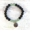 Aventurine & lava stone You Are Well Aromatherapy Bracelet by ZEN by Karen Moore on white wood