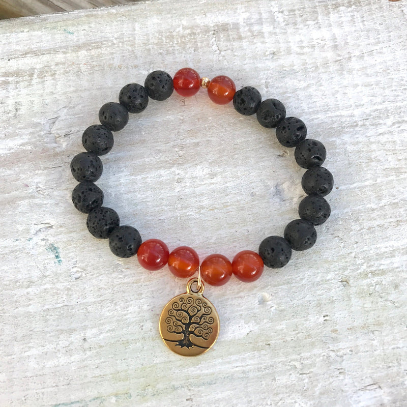 Carnelian & lava stone Create Your Fate Aromatherapy Bracelet by ZEN by Karen Moore on white wood