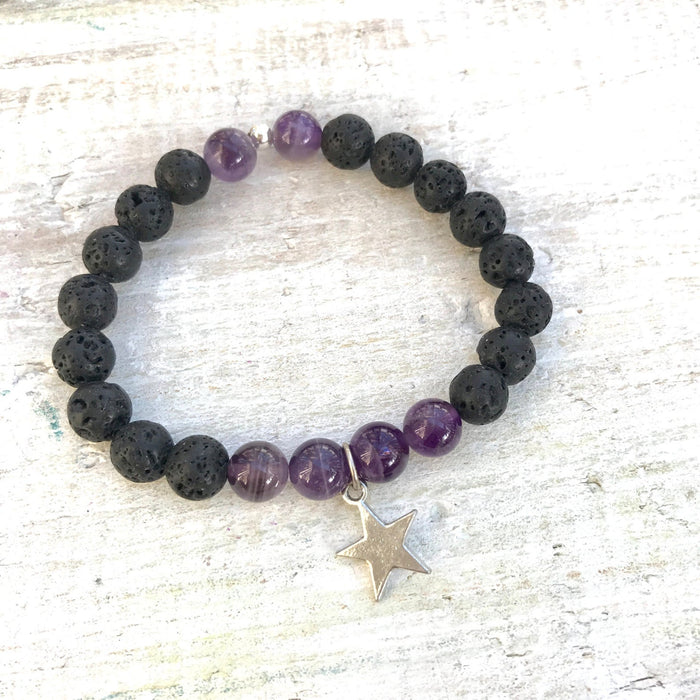 Amethyst & lava stone Inner Guide Aromatherapy Bracelet by ZEN by Karen Moore on white wood