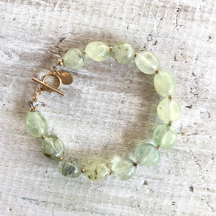 Reach Your Highest Potential prehnite bracelet by ZEN by Karen Moore on white wood