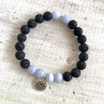 Blue lace agate & lava stone My Happy Day Lotus Aromatherapy Bracelet by ZEN by Karen Moore on white wood