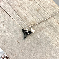 Sharmkie Charm pearl & shark tooth charm necklace by ZEN by Karen Moore on wood background