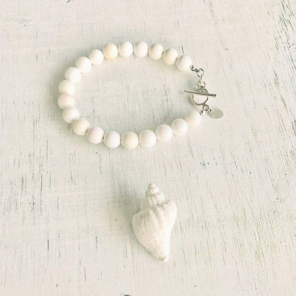 Purely Conch Shell Bracelet by ZEN by Karen Moore jewelry with seashell on white wood