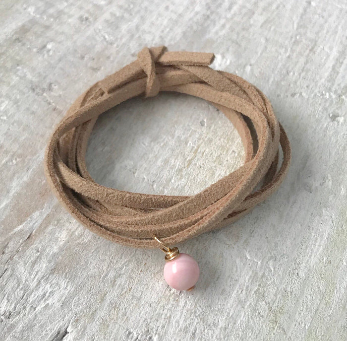 Inspire Conch Shell Eco ZEN Wrap® jewelry by ZEN by Karen Moore on white wood