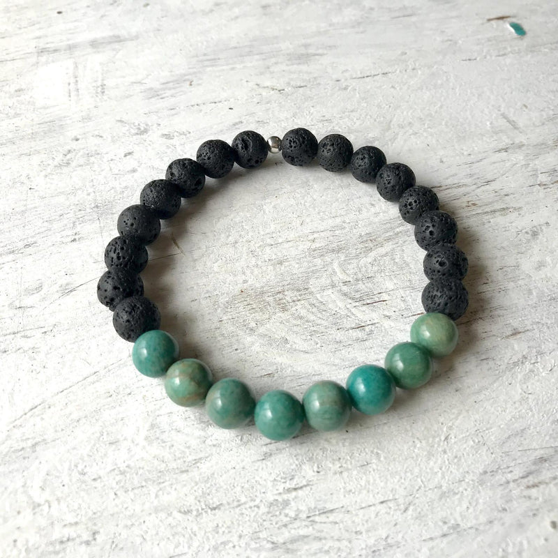 African turquoise & lava stone Be Healthy Aromatherapy Bracelet by ZEN by Karen Moore on white wood
