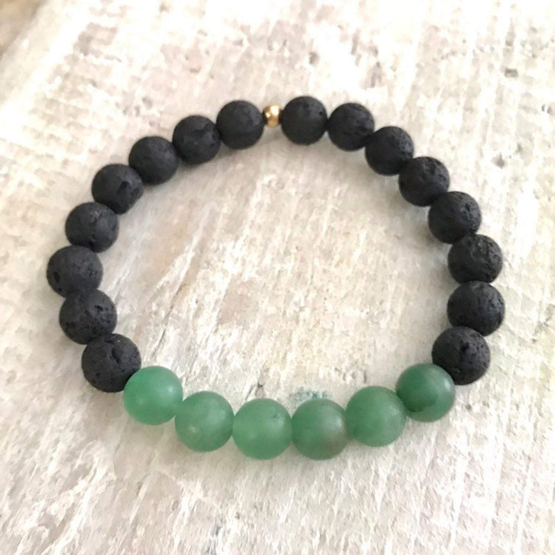 Aventurine and lava stone Be Well Aromatherapy Bracelet by ZEN by Karen Moore on white wood