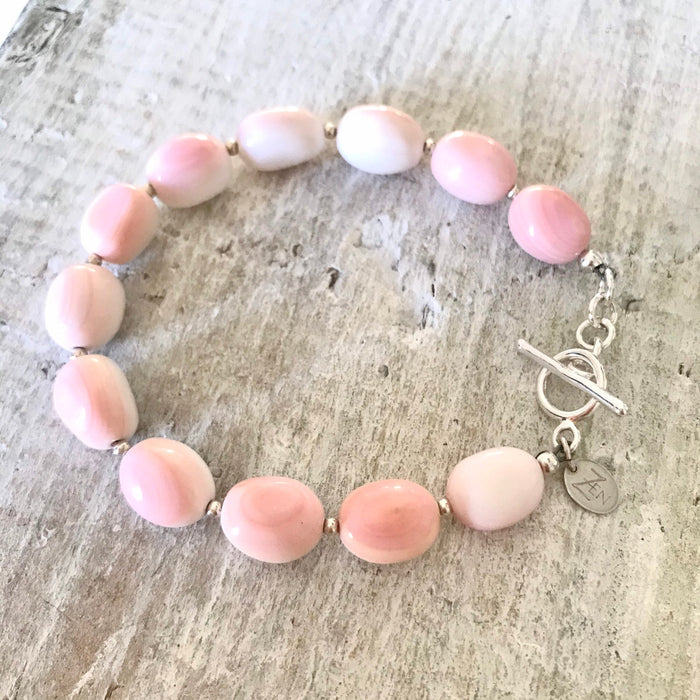 Conch shell Treasure Of Conch Shell bracelet with silver clasp by ZEN by Karen Moore on white wood